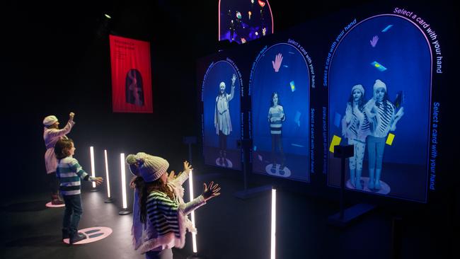 Twins Scarlett and Sienna with brother Max and mum Irene Moon at Mirror Mirror, part of Illuminate Adelaide in Victoria Square. Picture Matt Turner.