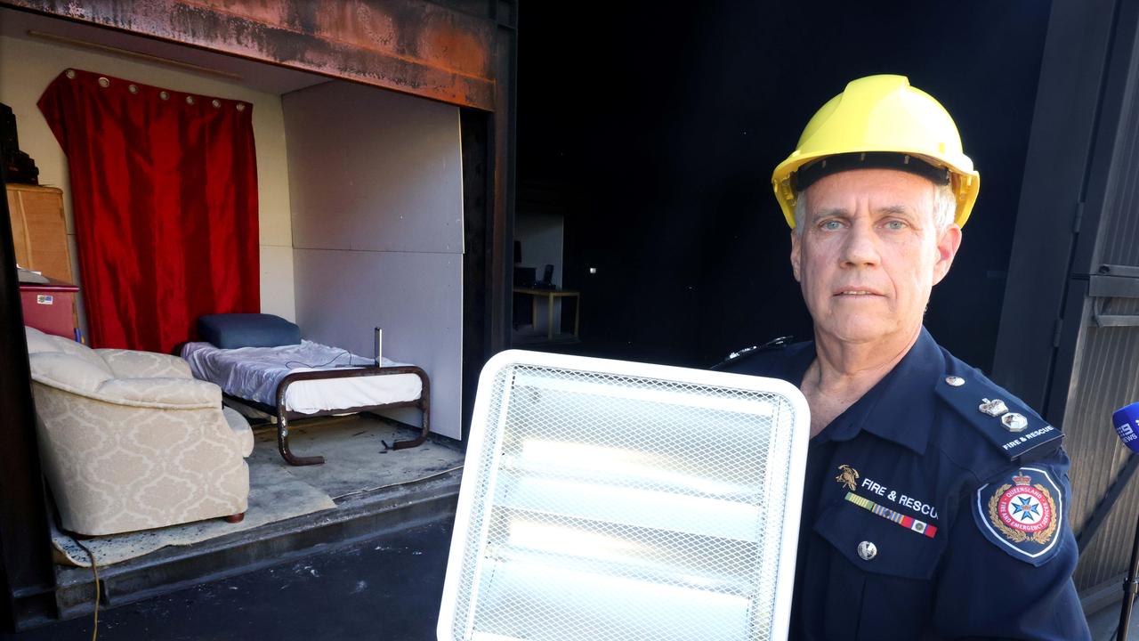 Superintendent Mark Halverson showing how a heater can quickly set fire to a room if not properly used. Photo Steve Pohlner