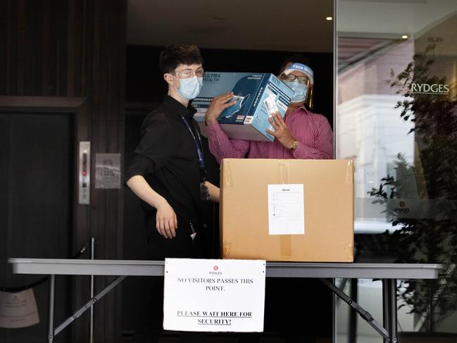 Staff at Rydges receive a delivery of PPE. Picture: NCA NewsWire / David Geraghty