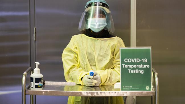 Temperature testing at the entrance to Parliament House in Canberra. Picture: NCA NewsWire/Martin Ollman