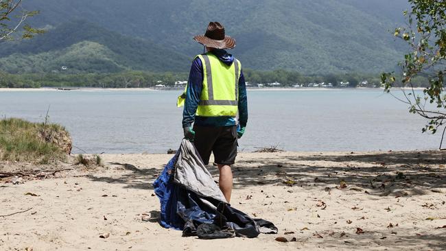 Businessman Audrius Macernis has purchased Taylor Point, the northmost parcel of land at Trinity Beach, for an undisclosed sum. The environmentalist plans to work with other conservation groups through his own organisation, the Macernis Group, to restore the landscape and bring Taylor Point back to its natural state. Taylor Point owner Audrius Macernis dismantles a tent that was set up on the headland by squatters. Picture: Brendan Radke