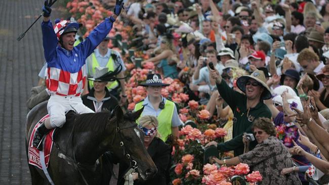 Jockey Glen Boss celebrates at the finish of the 2005 Melbourne Cup won by Makybe Diva. 