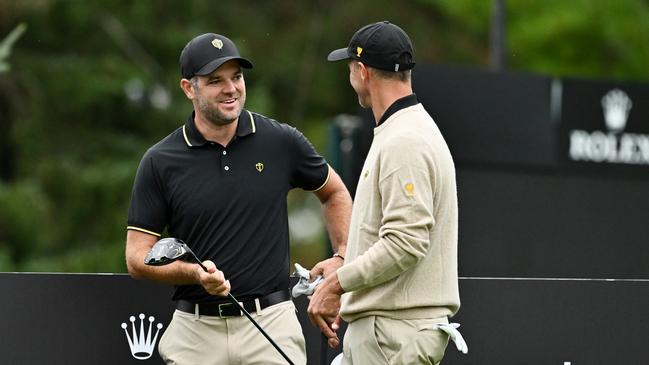 Adam Scott revs up teammate Corey Conner at The Royal Montreal Golf Club. Picture: Minas Panagiotakis/Getty Images