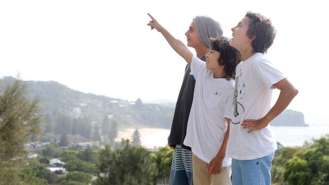 Reuben 14, Oli, ten, and Noah 12, survey the sky for Penguin. Picture: Martin Lange