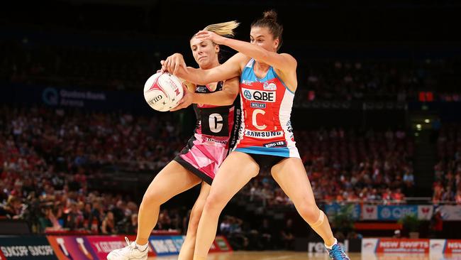 Swifts centre Maddy Proud battling Gia Abernethy of the Thunderbirds in round two of Super Netball.