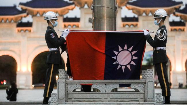 A Taiwanese honour guard at a flag lowering ceremony at Liberty Square in Taipei. Picture: Bloomberg