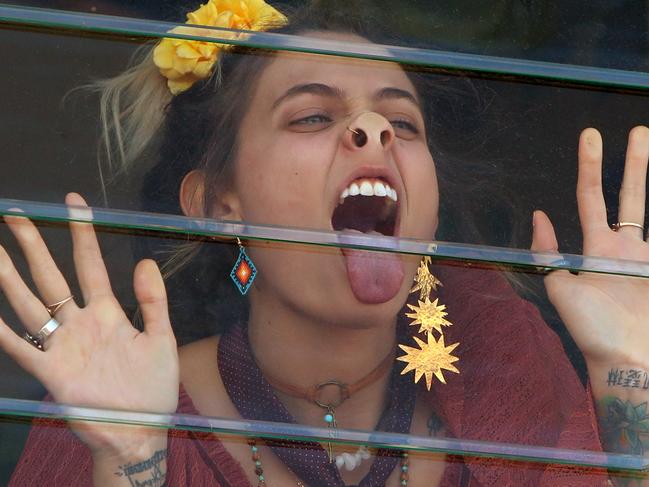 07/11/2017: Paris Jackson presses herself up against the window of the Myer Marquee during the Emirates Melbourne Cup day at Flemington Racecourse.  Stuart McEvoy for the Australian.