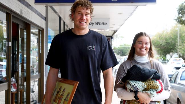 Alex Morse (R) and housemate Harry Dear (L) enjoy shopping at op shops like Salvos and Vinnies and have noticed a difference in pricing for similar items. Picture: Toby Zerna