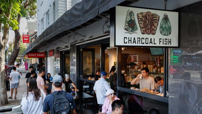 People flocked to Charcoal Fish on the last day of trading. Picture: Max Mason-Hubers