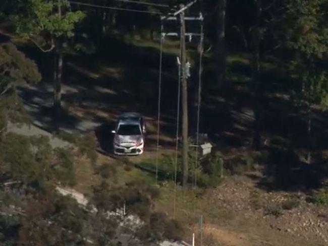 Emergency services rallying to rescue the woman trapped on a cliff face at Wongawallan on the Gold Coast. Picture: 7 News Gold Coast