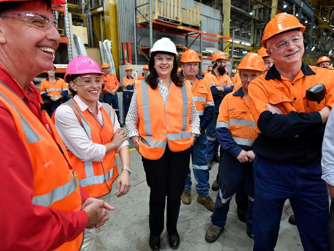 Queensland Premier Annastacia Palaszczuk (centre) and Deputy Premier Jackie Trad (2nd from left) at the Downer EDI Rail manufacturing plant in Maryborough during the 2017 Queensland Election campaign. Picture: AAP/Darren England