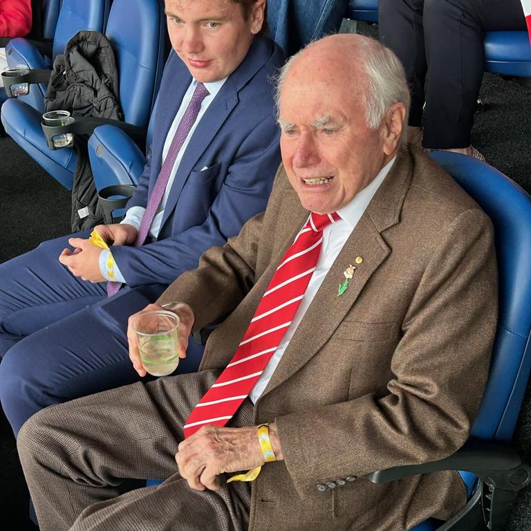 Former Prime Minister John Howard taking in the action at the traditional Anzac Day NRL clash between the Dragons and the Roosters. Credit: Supplied.