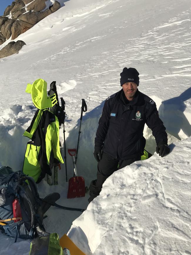 Senior Constable Daniel Draper outside his snow cave. Picture: Supplied