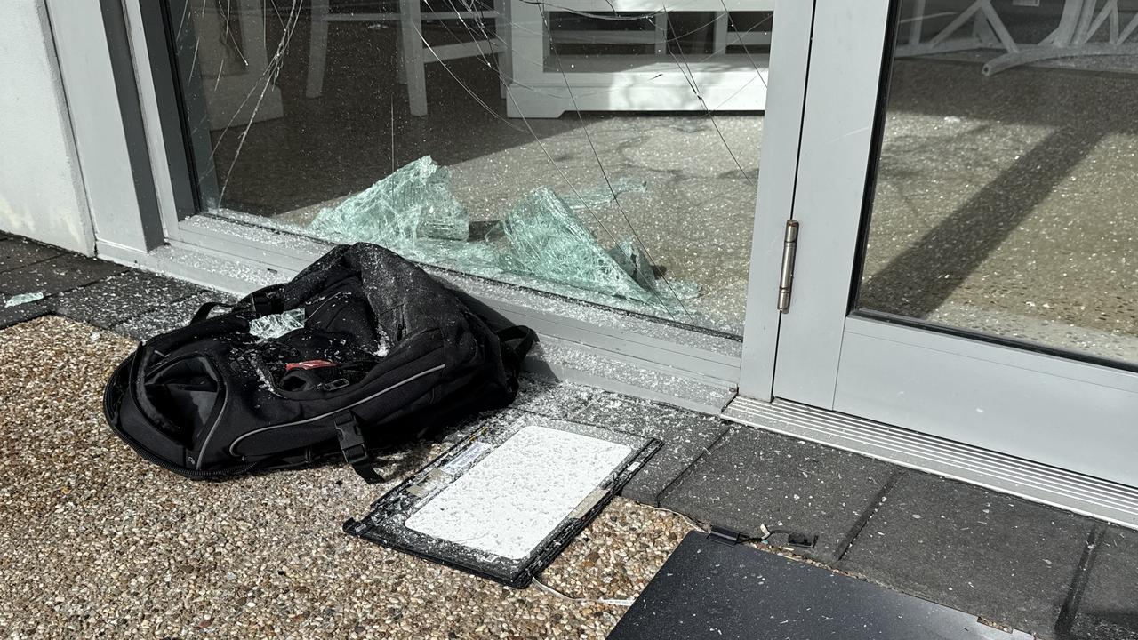 Seven shopfronts were found smashed up at Domain Central in Townsville on Friday morning. Picture: Natasha Emeck