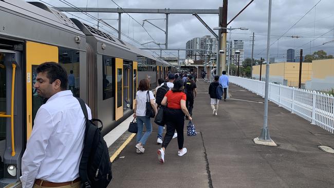 Commuters exiting a train at Clyde Railway Station.