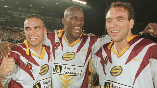 Anthony Mundine, Wendell Sailor and Gorden Tallis celebrate after the Super League grand final at ANZ Stadium Brisbane Bronc...