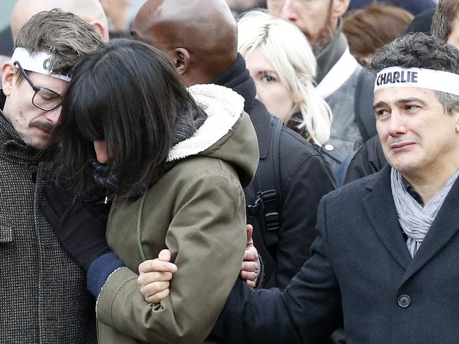 Pain ... Charlie Hebdo newspaper staff, with editorialist Patrick Pelloux, right, cartoonist Renald Luzier, known as Luz, left. Picture: Michel Euler/AP