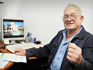 Popular Gympie businessman Noel Atkinson checks out an internet image of the Gold Coast apartment complex he has just won in an RSL lottery. Picture: Renee Pilcher