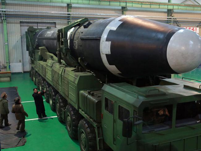 Kim is picture beside the Hwasong-15 intercontinental ballistic missile. Picture: KCNA/AFP