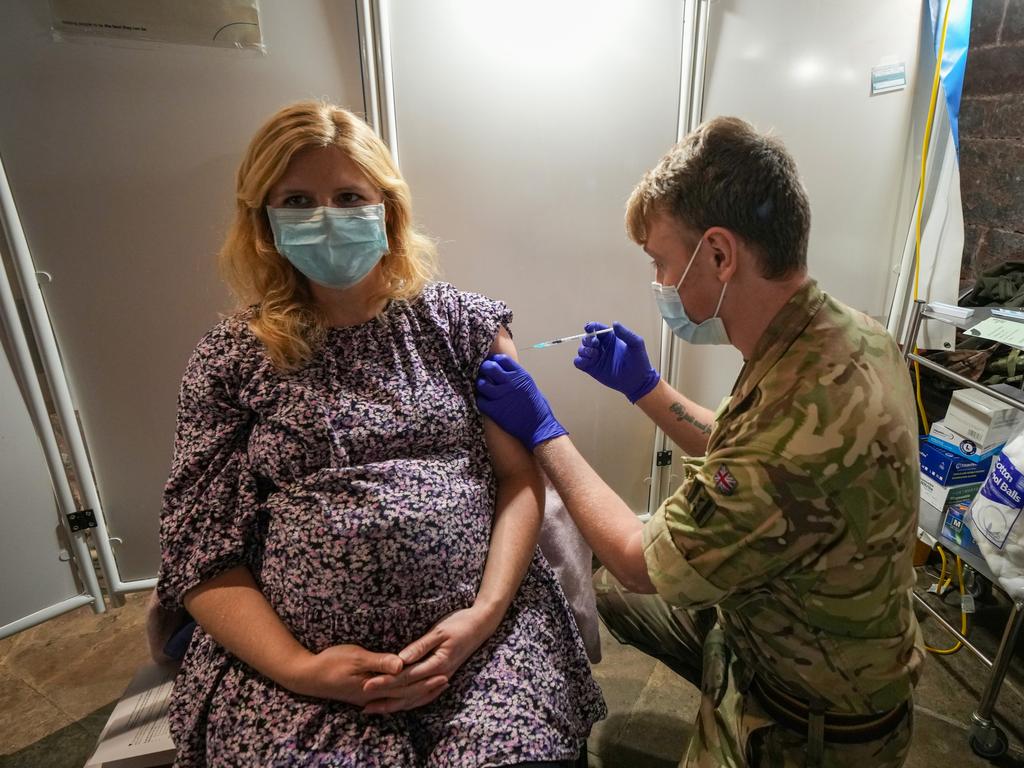 A British woman receives her booster Covid-19 vaccine from soldiers at the Chester Cathedral in Manchester. Picture: Getty Images