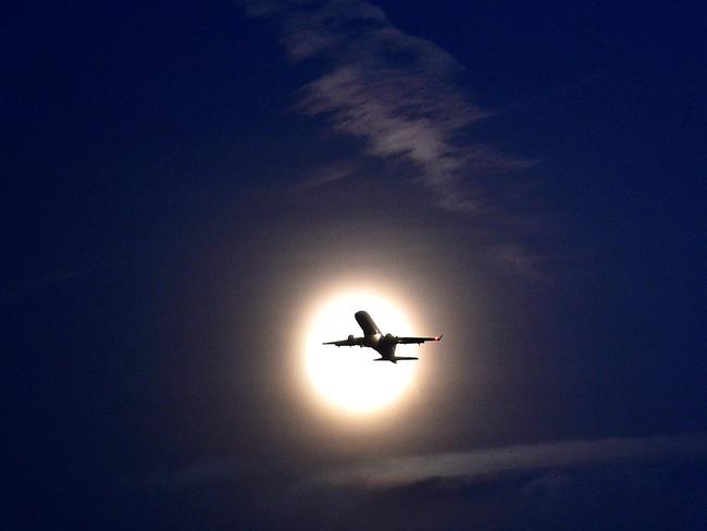 A plane takes off from London’s City Airport in front of the rising moon in London’s Docklands on November 13, 2016. Tomorrow, the moon will orbit closer to the earth than at any time since 1948, named a ‘supermoon’, it is defined by a Full or New moon coinciding with the moon’s closest approach to the Earth. Picture: AFP PHOTO / Glyn KIRK