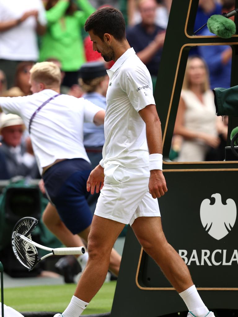 Novak Djokovic smashes his racket. (Photo by Clive Brunskill/Getty Images)