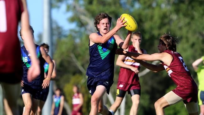 AIC AFL seniors match between Ambrose Treacy College and St Peters Lutheran College (Maroon top)Picture David Clark