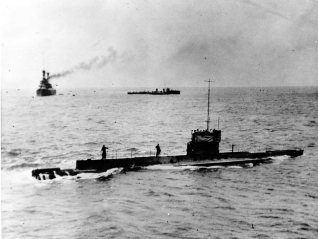 The submarine HMAS AE1 off Rossel Island 09 Sepember 1914, as seen from the bridge of the Encounter during the delivery of letters to the fleet. In the background are HMAS Australia and HMAS Yarra. Picture: Supplied