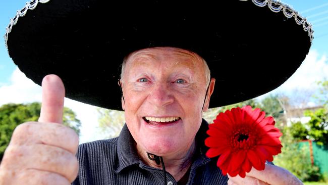 Walter Graves is the bayside's resident "flowerman". He sits out the front of his house on Old Cleveland Rd, Birkdale, most days and waves to everyone who drives past. Picture: Renae Droop