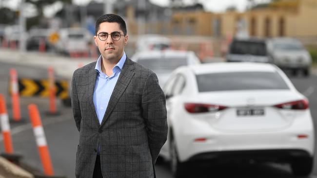 Joseph Haweil at the roadworks on Mickleham Rd in Greenvale. (Photo: Julian Smith)