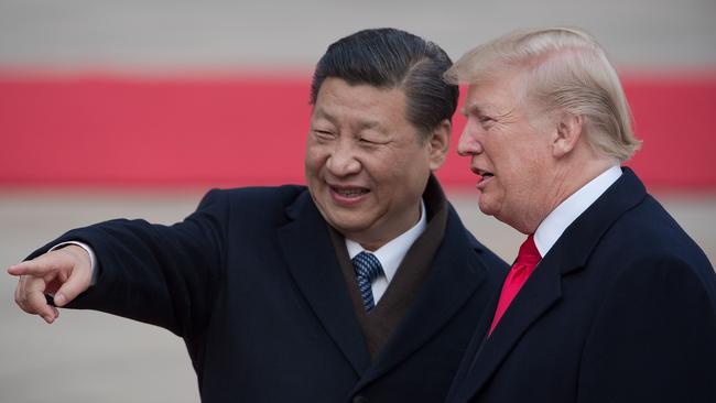 China's President Xi Jinping and US President Donald Trump attend a welcome ceremony at the Great Hall of the People in Beijing. Picture: AFP