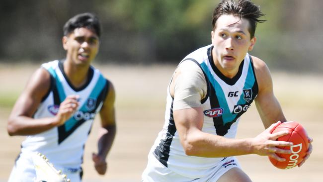 ON THE RUN: Young Port Adelaide forward Tobin Cox bursts clear against the Crows on Saturday. Picture: DAVID MARIUZ (AAP).