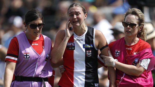 A shattered Tarni White is helped from the field at Moorabbin.