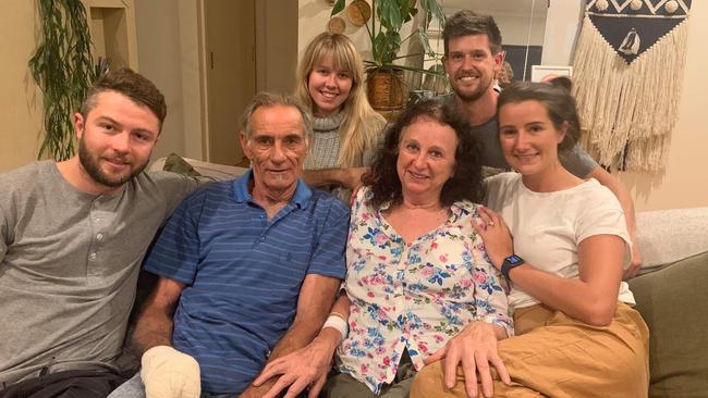 Mary and Dennis Gilbert are reunited with loved ones after surviving the fire which destroyed their home. Picture: Supplied