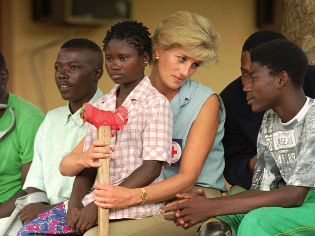 Princess Diana talks to amputees, at the Neves Bendinha Orthopedic Workshop near Luanda, Angola, which Prince Harry also visited 22 years later. Picture: AP Photo/Joao Silva, File.