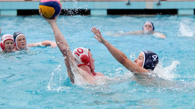 Connor Bradshaw and Tom Liddell do battle in the under-14 clash between Gosford and Wyong at Gosford Pool on Saturday. Picture: Sue Graham