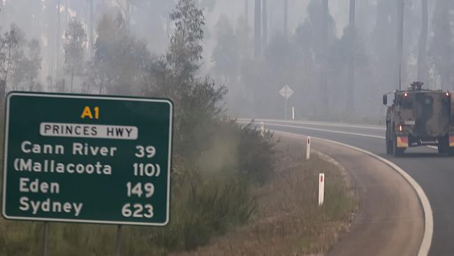 An Australian Defence Force vehicle personnel carrier is seen on the Princes Highway near Mallacoota. Picture: Getty Images