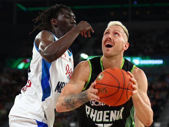 MELBOURNE, AUSTRALIA - NOVEMBER 19: Mitchell Creek of the Phoenix (R) drives at the basket during the round seven NBL match between South East Melbourne Phoenix and Melbourne United at John Cain Arena, on November 19, 2022, in Melbourne, Australia. (Photo by Graham Denholm/Getty Images)