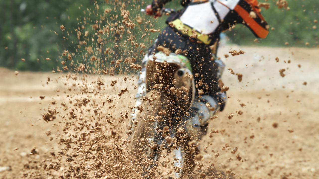 General, generic stock photo of mud debris flying from a rear tyre of a trail bike during a motocross dirt bike race. Photo: iStock - Getty Images.