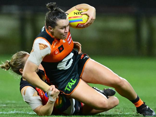 Jaimee Lambert has one arm of Alyce Parker as she tackles her to the ground. Picture: Getty Images