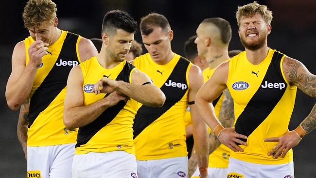 Tom Lynch,Trent Cotchin, Nathan Broad react as they leave the field with their teammates after losing the Round 4 AFL match between the St Kilda Saints and the Richmond Tigers at Marvel Stadium in Melbourne, Saturday, June 27, 2020. (AAP Image/Scott Barbour) NO ARCHIVING, EDITORIAL USE ONLY