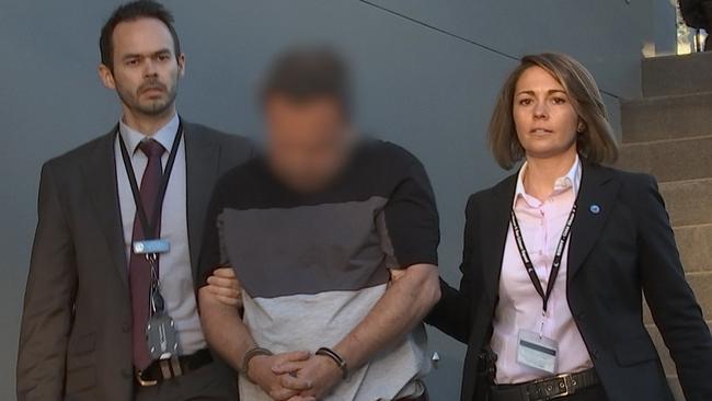 Detectives arrest Gregory Richardson on Thursday after re-investigating a series of historic sexual assaults in the Ryde area. Picture: NSW Police