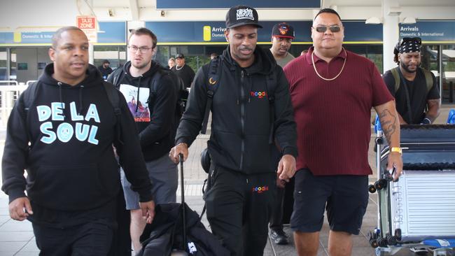 Naughty By Nature's Vin Rock (left) and DJ Kay Gee (centre) arrive at Darwin airport ahead of their show at the Discovery nightclub on Sunday night. Picture: Jason Walls