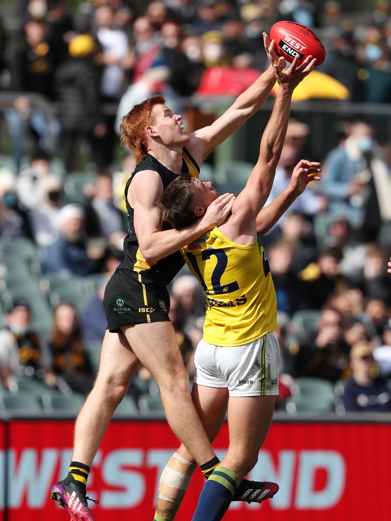 Toby Pink of Glenelg and Jack Hayes of the Eagles battle for the ball. Picture: Sarah Reed