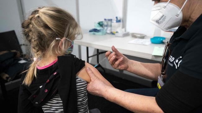 A child receives a dose of the vaccine against the Covid-19. Picture: Jeroen Jumelet /ANP/AFP