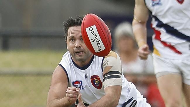 Chris O'Keefe shoots out a handball for Caulfield. Picture: Valeriu Campan