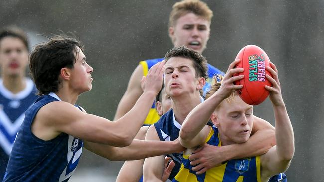 Ethan Sorrell of Frankston District is tackled. (Photo by Josh Chadwick)