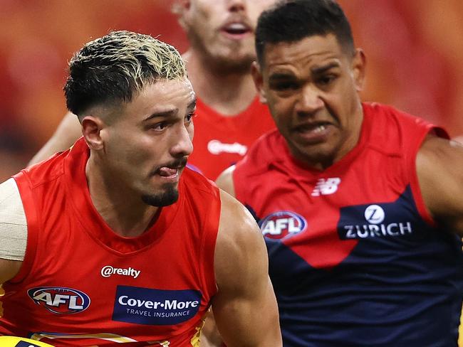 SYDNEY, AUSTRALIA - JULY 11: Izak Rankine of the Suns runs the ball during the round 6 AFL match between the Melbourne Demons and the Gold Coast Suns at GIANTS Stadium on July 11, 2020 in Sydney, Australia. (Photo by Cameron Spencer/Getty Images)