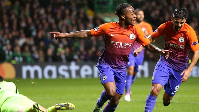 Manchester City's Raheem Sterling, centre, celebrates scoring his side's second goal.