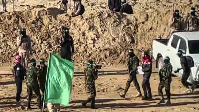 This screen grab from an AFPTV footage shows Israeli hostage Yarden Bibas being handed over to members of the International Red Cross upon his release in Khan Yunis.